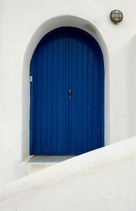 SANTORINI, GREECE Greek Doors Entrance, Blue Door House, Greece Painting, Greek Blue, When One Door Closes, Mediterranean Blue, Santorini Island, Arched Doors, Blue Paint Colors