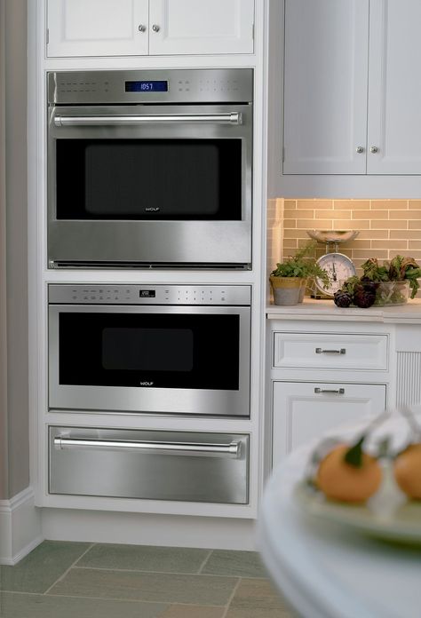 "MADE FOR EACH OTHER To create a beautifully coordinated suite of Wolf appliances, the built-in ovens are designed to be installed in a "tower" configuration with other Wolf cooking products, including the convection steam oven, drawer-style or door-front microwave, and warming drawer." Love this combo Wall Oven Microwave Combo, Luminaria Diy, Wolf Appliances, Wall Oven Microwave, Steam Oven, Single Oven, Smitten Kitchen, Warming Drawer, Built In Ovens