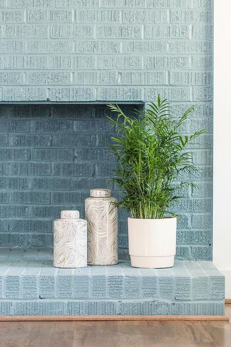 Blue Painted Brick Fireplace, Painted Brick Wall Interior, Raleigh Photography, Flower Care Tips, Round Concrete Dining Table, Painted Brick Wall, Brick Wall Living Room, Brick Fireplace Wall, Brick Living Room