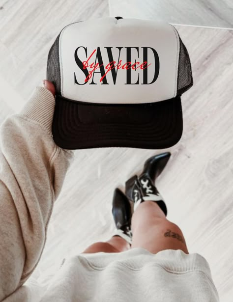 Show your faith wherever you go with this trendy Saved By Grace trucker hat  Featuring a bold and eye-catching design, this hat is perfect for those who love to make a statement. Made from high-quality materials, this hat is built to last and stay comfortable. Perfect for beach days, concerts, or everyday wear, this Saved By Grace trucker hat is a must-have for any Christian fashionista. Trucker caps are perfect for merchandising--they're versatile and fit almost any occasion. A 100% polyester f Christian Trucker Hats, Trendy Trucker Hats, Christian Clothing Brand, Christian Accessories, Christian Hats, Christian Shirts Designs, Faith Clothing, Cute Shirt Designs, Streetwear Fashion Women