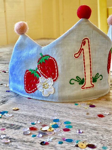 Perfect for a June Birthday! #strawberrybirthday #Strawberryembroidery #junebirthday #linencrown #pompomcrown Embroidered Birthday Crown, Felt Crown Diy, Felt Birthday Crown Diy, Waldorf Crown, Felt Birthday Crown, Half Way To One, Diy Birthday Crown, First Birthday Crown, Birthday Crowns