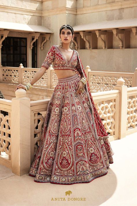 Timeless silhouettes for modern Indian weddings in elegant motifs & handcrafted details.

An ode to the old, a nod to the new, this outfit embodies the timeless spirit of heritage craftsmanship in gota patti, and zardosi embroidery, with a modern mindset.

Fabric: Raw Silk, Tulle.
Gota patti, resham, zardosi, and sequin embroidery.
Comes with pockets.
Set includes: Lehenga, Choli & two Dupattas. Anita Dongre Lehenga, Rajasthani Lehenga, Elegant Lehenga, Modern Indian Wedding, Zardosi Embroidery, Lehenga Red, Organza Lehenga, Anita Dongre, Designer Bridal Lehenga