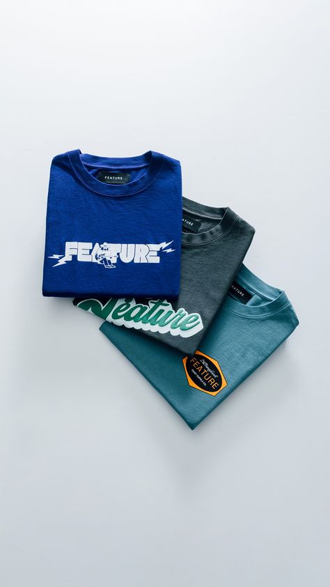 Introducing our latest graphics — FEATURE Flip Capsule 🔥 Available Friday 9/30 at all retail locations + online. Graphic Tees Flatlay, Graphic Tee Flat Lay, Tshirt Product Photography Ideas, Tshirt Photoshoot Ideas, Tshirt Photoshoot Ideas Products, Tshirt Product Photography, T Shirt Photography Ideas, Retail Photography, Clothes Photoshoot