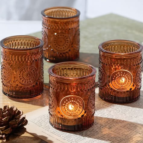 PRICES MAY VARY. Decoration and Gift: glass votive candle holders are very good decorations for weddings and festivals. Vintage candle holders add character to your setting. Candle holders can also be given to your relatives and friends as gifts, they will be very happy. Appearance: The surface of the brown candle holder is engraved with dots, stripes and sunflower patterns, which looks full of vintage flavor; amber light shines out to make your small candle holder more unique, and it is very co Wedding Decorations Vintage, Brown Candle Holders, Gold Votive Candle Holders, Gold Votive Candles, Brown Candles, Table Centerpieces For Home, Small Candle Holders, Glass Votive Candle Holders, Glass Tea Light Holders