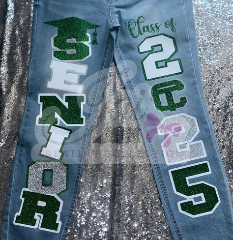 CUSTOM JEANS 💚🩶🤍 customized by @jaicreativecollection 🎀 —————————— DM or TEXT (313)318-0114 to place an order📲 ✨ —————————— (JEANS👖 PROVIDED BY CUSTOMER! CUSTOMIZATION FEE $65!) —————————— #senior2025 #2025 #seniorszn #classof2025 #jaicreativecollection🎀 #seniorsets #customseniorjeans #seniorjeans #detroitsmallbusiness #trojans #customizedjeans ##seniorskirt #customseniorjeans #panthers Senior Jeans Ideas, Hoco Jeans, Senior Painted Jeans, Senior Pants, Senior Jeans, Senior Year Fun, Senior Szn, Senior Stuff, Senior Overalls