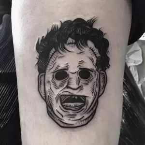 Leather face from the Texas chainsaw massacre tattoo Leatherface Tattoo Ideas, Texas Chainsaw Mascara Tattoo, Leather Face Tattoo Design, Small Horror Tattoos, Leather Face Tattoo, Texas Chainsaw Tattoo, Leather Face Texas Chainsaw, Slasher Tattoo, Leatherface Tattoo