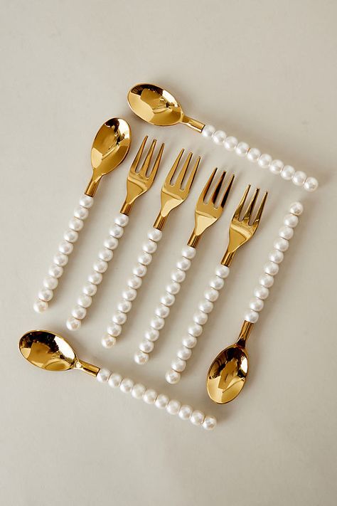 Enjoy a spoonful of sophistication with these fabulously fun gold-plated spoons. Crafted from stainless steel and embellished with chic pearls, they're made for glamorous gatherings, or they'll make a wonderful gift for cutlery collectors! | Pearl Spoons, Set of 2 by Lepelclub in White at Anthropologie Cute Cutlery Set, House Utensils, Tea Sets Modern, Beautiful Kitchenware, Glamorous Kitchen, Kitchen Decor Collections, Crockery Design, Gold Spoon, Spoon Collection