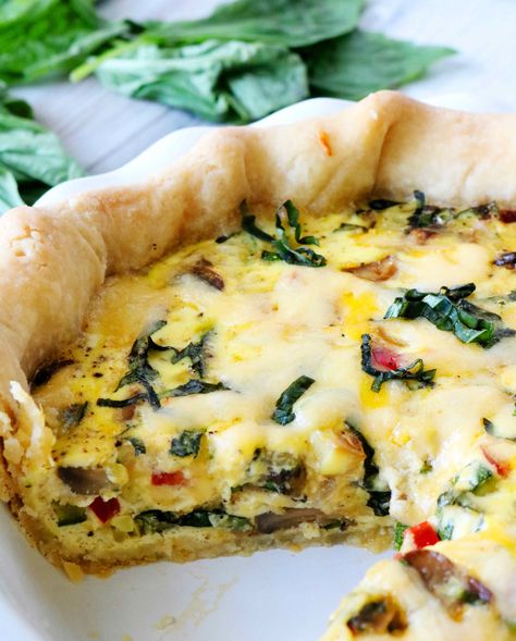 A tall, deep dish veggie quiche with a slice cut out of it. Hobbit Cookbook, Garden Quiche, Veggie Quiche Recipes, Cookbook Inspiration, Brunch Sides, Veggie Quiche, Vegetable Casserole Recipes, Quiche Recipe, Homemade Pie Crusts