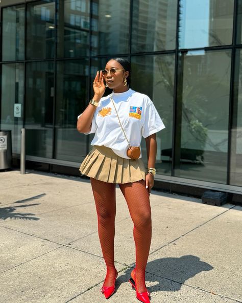 Who knew you could pair a brown mini pleated skirt with red tights and shoes?
Stylish, graphic tshirt, white t-shirt, ashluxe, streetstyle, colored tights. Tshirt And Skirt, Mini Pleated Skirt, Red Tights, Colored Tights, Red Shoes, White Tshirt, Pleated Skirt, Tights, Street Style