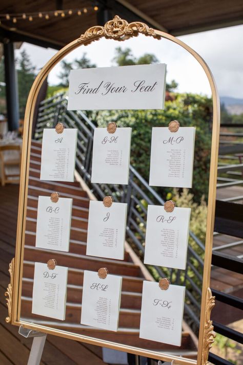 Wedding Seat Chart Alphabetical, Mirror Guest List Wedding, Guest Table Assignments Ideas, Mirror Alphabetical Seating Chart, Reception Seating Chart Mirror, Mirror Table Seating Chart Alphabetical, Creative Seating Chart Wedding Party Favors, Wedding Guest List Mirror, Table Seating Chart Wedding Alphabetical