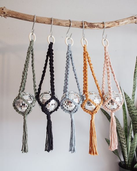 Make your home sparkle with these macrame disco ball hangers! Hang by a sunny window from the ceiling, wall, or right on your curtain rod and watch the magic happen. This groovy babe is made with a wooden ring, 4 inch disco ball and 100% zero waste, recycled cotton cord. Measures approx. 22 inches long and 4 inches wide. Crochet Disco Ball Holder, Disco Ball Macrame Hanger, Macrame Door Hanger, Disco Ball Plant Hanger, Disco Ball Car Charm, Crochet Disco Ball, Macrame Disco Ball Hanger, Disco Macrame, Disco Ball Macrame