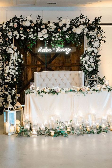 Sweetheart Table Wedding Love Seat, White And Greenery Sweetheart Table, Couch Sweetheart Table, Backdrop For Bride And Groom Table, Sweetheart Table Wedding Couch, Bride Snd Groom Table, Sweetheart Table With Couch, Floral Arch Sweetheart Table, Sweetheart Table Couch