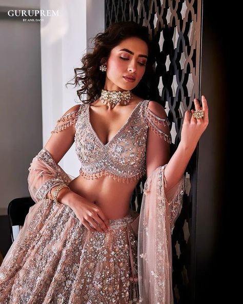 "Introducing our Rosegold Lehenga Special Collection, where elegance meets enchantment. Each lehenga is meticulously crafted with intricate embroidery and luxurious fabrics, offering a perfect blend of classic charm and contemporary flair. Our collection features a stunning array of rose-hued designs that promise to make every moment unforgettable. From delicate embellishments to exquisite finishes, these lehengas are designed for the modern woman who cherishes tradition and embraces sophisti... Elegant Lehenga, Bridal Crop Top, Kaftan Kurta, Global Wedding, Kurta Lehenga, Dusty Brown, Waistcoat Woman, Organza Lehenga, Ethnic Chic