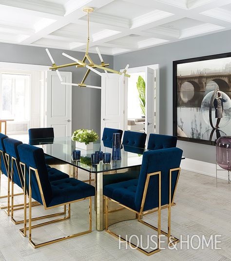 A modern glass table and chandelier with fluorescent tubes bring the room into the 21st century while plush navy velvet chairs add comfort. | Design: Kirsten Marshall, Palmerston Design Consultants | Photo: Alex Lukey Dining Suites, Mid Century Modern Interiors, Luxury Dining Room, Hall Decor, Stylish Living Room, Interior Modern, Dining Room Inspiration, Luxury Dining, Dining Room Chandelier