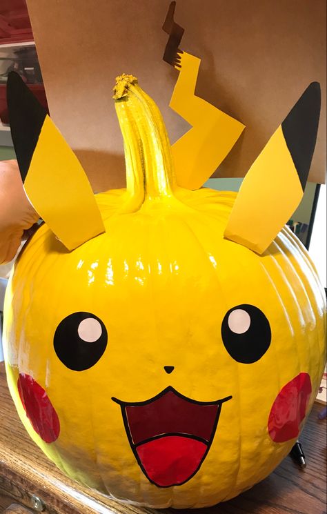 Spray painted yellow, cut stickers with my Cricut ❤️ Flash Pumpkin Painting, Yellow Pumpkin Ideas, Pikachu Pumpkin Painting, Squirtle Pumpkin, Eevee Pumpkin, Pokemon Pumpkin Painting, Anime Pumpkin Painting, Pokeball Pumpkin, Pumpkin Pikachu