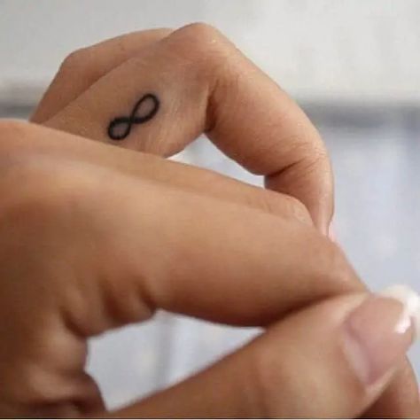 30 Small Minimalistic Tattoo Ideas & Inspiration - Brighter Craft Infinity Finger Tattoos, Infinity Sign Tattoo, Minimalist Tattoo Meaning, Infinity Tattoo Designs, Finger Tattoo For Women, Shape Tattoo, Small Tattoos Simple, Infinity Tattoos, Tattoos Skull