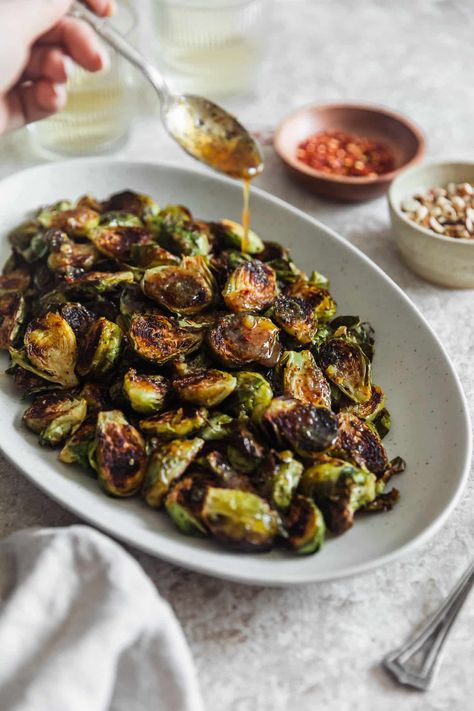 The Best Hot Honey Brussels Sprouts • Sunday Table Hot Honey Chicken And Brussel Sprouts, Honey Roasted Brussel Sprouts, Honey Sriracha Brussel Sprouts, Honey Balsamic Brussel Sprouts, Side Dishes For Dinner, Honey Brussel Sprouts, Hot Honey Sauce, Baked Brussel Sprouts, Easy Veggie Side Dish