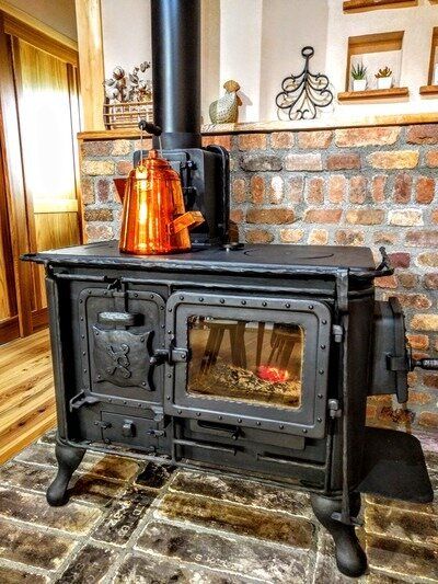 Wood Stove In Kitchen, Stove In Kitchen, Wood Cook Stove Kitchen, Wood Burning Stove Corner, Cast Iron Garden Furniture, Wood Cook Stove, Victorian Tiny House, Wood Stove Hearth, Wood Burning Stoves Living Room