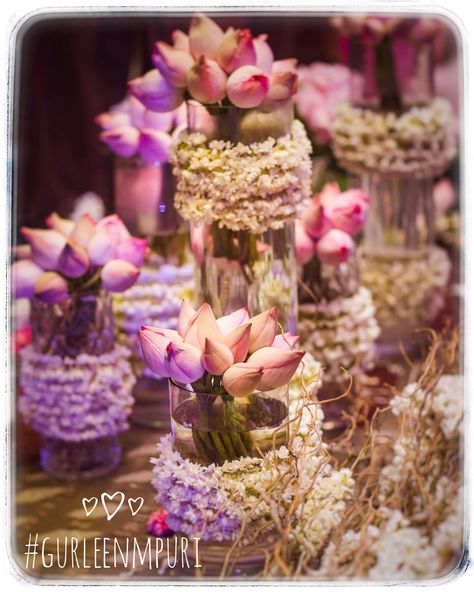 The lotus flower symbolizes beauty, divinity, knowledge, and enlightenment. This gorgeous floral arrangement is one-of-a-kind 💗💗 Weddings by Gurleen M Puri Lotus Flower Decoration Wedding, Lotus Flower Centerpiece, Lotus Flower Wedding Decor, Lotus Theme Wedding Decor, Lotus Flower Decor, Lotus Table Decor, Lotus Theme Decoration, Lotus Wedding Decor, Lotus Decoration Ideas