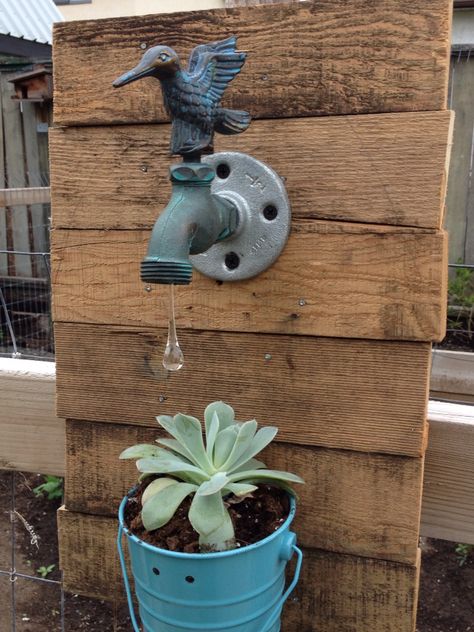 Pallet pieces make up the frame for our water drop succulent planter. Turn a neat garden faucet into a garden showpiece. Glass water drop from www.turtlebeads.com Neat Garden, Backyard Art, Garden Faucet, Yard Ideas Backyard, Container Garden Design, Metal Artwork Wall, Outdoor Crafts, Ariat Boots, Veg Garden