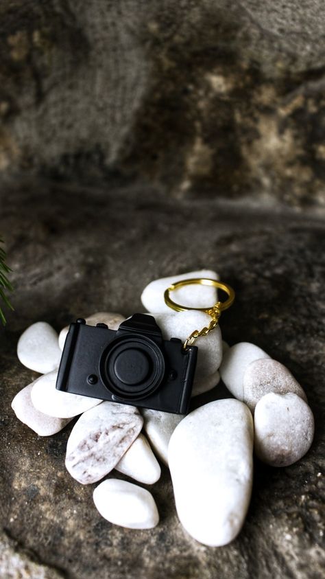 Pictured is a digital camera keychain. Many colors are available. This makes the perfect gift for a photographer, a photography class etc. Make someone feel special! Our keychains are 3D designed, Printed and painted all in house. I am a small 1 man company, welcome to Stay Brolic and I hope to process your order today! Keychain Photoshoot, Keychain Photography Ideas, Keychain Inspiration, Keychain Photography, Photography Digital Camera, Merch Photoshoot, Aesthetic Gifts, Camera Keychain, Printed Gifts