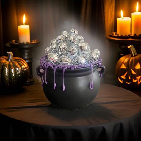 Spooky season is upon us! Channel your inner witch with this groovy disco ball cauldron.  The cauldron is made of ceramic with hot glue used to create the purple drip around the edges as well as to affix the mixed glass disco balls to make a really sparkly conversation decor piece for your coffee table!  This creation does NOT light up. If you are interested in a custom order where it would light up, please reach out to me! Please note that this creation is made-to-order. Once paid, this item ta Spooky Disco, Inner Witch, The Cauldron, Witches Halloween, Disco Balls, Trunk Or Treat, Fall Halloween Decor, Disco Ball, Hot Glue