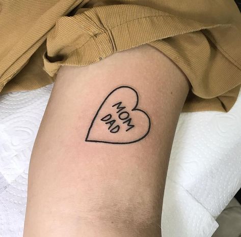 Parents Names Tattoo Ideas, Mom In Heart Tattoo, Heart With Words Tattoo, Thigh Word Tattoo Women, Tattoo Parents Mom And Dad, Name In Heart Tattoo, Tattoos For Mom And Dad, Heart Name Tattoo, Mom And Dad Tattoo Ideas