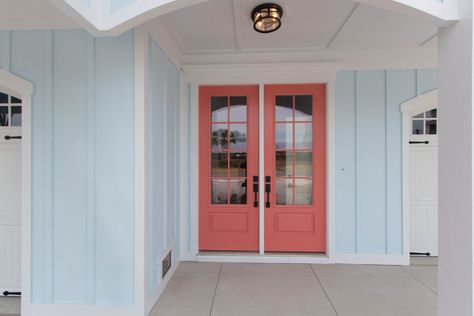 Beach Home 247 | Ocean Isle Beach Home Build | Carolina Bluewater Construction Beachy Exterior House Colors, Light Blue House Exterior, Coastal Homes Exteriors, Beachy Bungalow, Coral Front Doors, Coral Door, Light Blue Houses, Coastal Home Exterior, Beach House Exterior