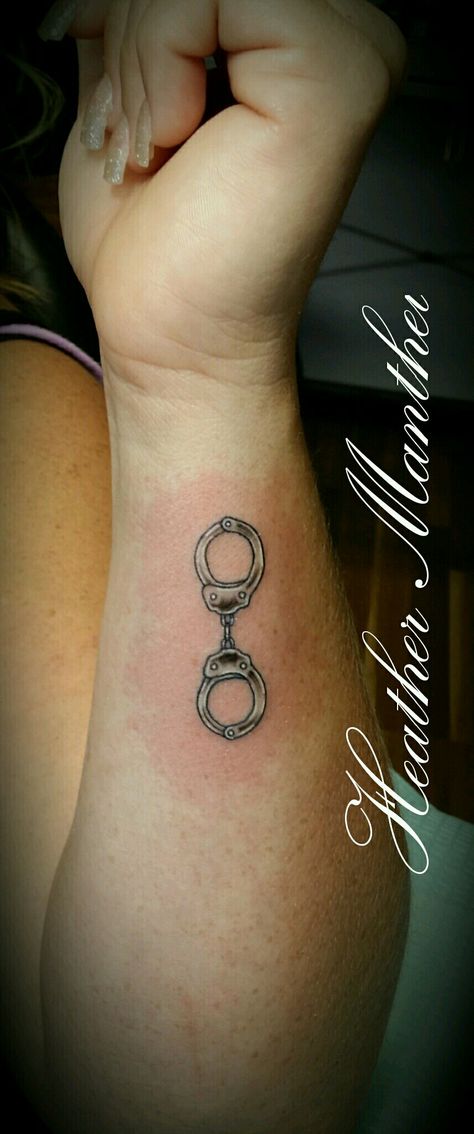 Handcuff tattoo design. Thank u Mande! Handcuffs Tattoo Design, Female Law Enforcement Tattoos, Police Tatoos Ideas, Police Officer Tattoos Female, Handcuff Tattoo For Women, Cop Wife Tattoo, Small Police Tattoo Ideas, Law Enforcement Tattoos For Women, Police Tattoo Ideas Women