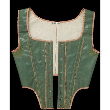 Front lacing stays, glazed green wool with a pink trim, made in Britain, 1790-1795. Museum Number T.69-1935. Regency Stays, 18th Century Stays, 18th Century Women, 18th Century Clothing, Dress History, Regency Fashion, 18th Century Fashion, Vintage Corset, Century Clothing