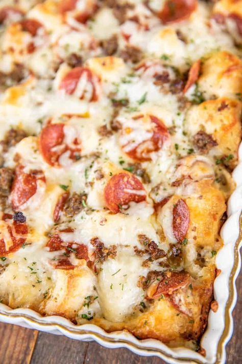 White Bubble Up Pizza - only 4 ingredients and ready in under 30 minutes! Refrigerated biscuits tossed in Alfredo sauce, topped with mozzarella, and your favorite pizza toppings. We LOVE this casserole! We make this at least twice a month!! #pizza #casserole #Alfredosauce Bubble Pizza, Plain Chicken Recipe, Bubble Up Pizza, Chicken Alfredo Pizza, Biscuit Pizza, Italian Pizza Recipe, Pizza Casserole, Bubble Up, Alfredo Sauce