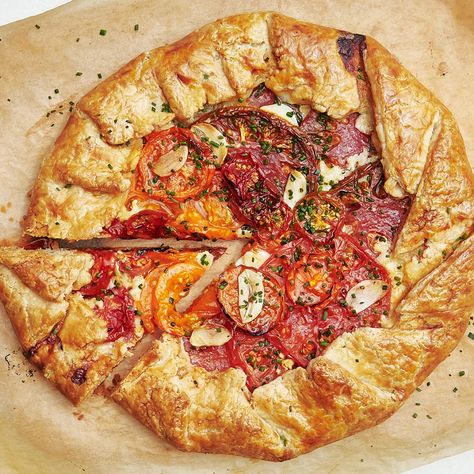 Tomato Galette Recipe | Bon Appétit Tomato And Cheese Galette, Savory Galette, Tomato Galette, Chives Recipe, Galette Recipe, Cooking Tomatoes, Small Tomatoes, Asiago, Heirloom Tomatoes