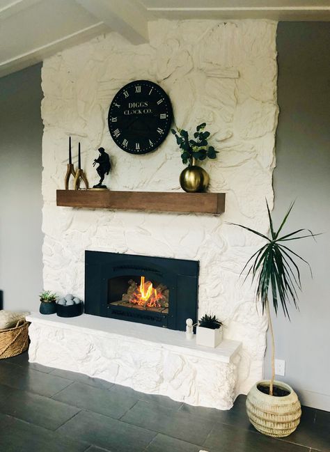 White Brick Wood Mantle, Stone Fireplace Makeover Modern, Fireplace Painting Ideas Stone, Painted Lava Rock Fireplace, Stone Fireplace Painted White, 70s Fireplace Makeover Stone, Lava Rock Fireplace Makeover, Lava Stone Fireplace, Painted Fireplace Rock