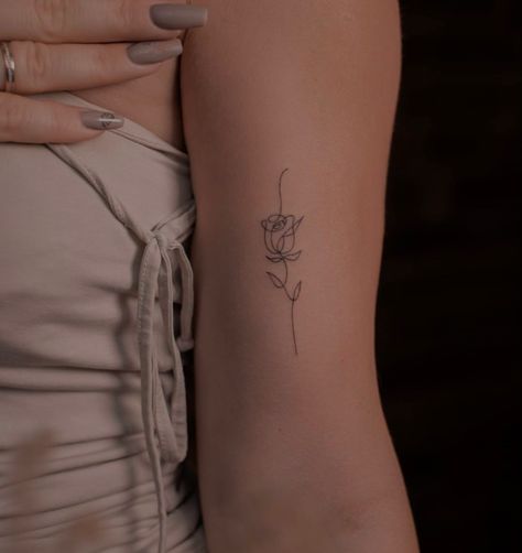 Tattoos To Get For Parents, Lightning Tattoo Women Arm, Minimalist Vertical Tattoo, Dainty Fine Line Tattoo Ideas, Small Bicep Tattoos For Women, Rose Arm Tattoos For Women, Rose Tattoo Minimalist, Small Ribcage Tattoo, Mini Arm Tattoos