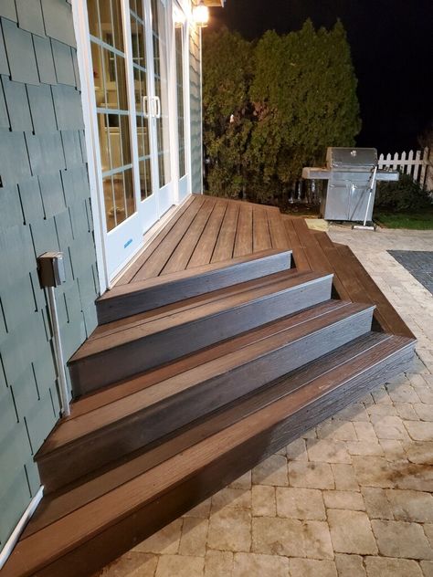 Steps From Deck To Yard, Stairs To Deck Ideas, Wood Stairs On Concrete Patio, Concrete Patio With Stairs From House, Backyard With Stairs, Steps To Backyard Patio, Back Patio Stairs Ideas, Pyramid Deck Steps, Steps For Back Door