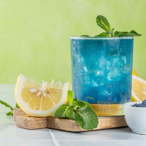 This refreshing blue lemonade drink of sodamndelish is a breeze to make, blending tangy fresh lemon juice with a splash of vibrant blue for a fun twist. Blue Lemonade Punch, Spirulina Lemonade, Blue Lemonade Cocktail, Blue Starburst Lemonade Jungle Juice, Blue Raspberry Lemonade Non Alcoholic, Electric Blue Lemonade, Blue Lemonade, Pasta Shop, Lemonade Drink