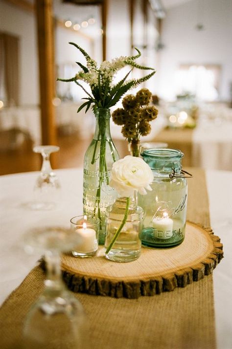 country mason jars wedding centerpiece / http://www.himisspuff.com/rustic-mason-jar-wedding-ideas/3/ Wood Slice Centerpiece, Wedding Jars, Burlap Mason Jars, Flowers And Candles, Rustic Mason Jars, Flower Arrangements Simple, Mason Jar Wedding, Rustic Centerpieces, Rustic Wedding Centerpieces