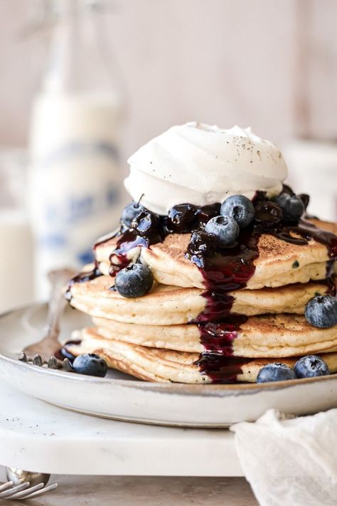 Soft and fluffy blueberry pancakes, topped with blueberry sauce and vanilla whipped cream. Pancake Recipe Almond Milk, Thick Pancake Recipe, Recipe With Almond Milk, Fluffy Blueberry Pancakes, Blueberry Pancakes Recipe, Crepe Suzette, Blueberry Pancake, High Altitude Baking, Breakfast Photography