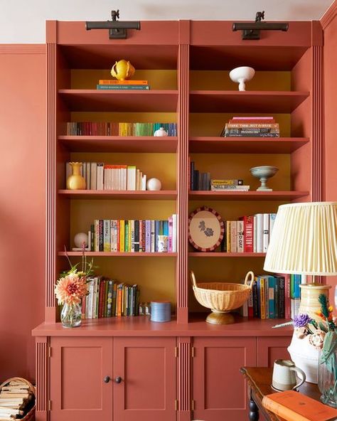 highfidelityhome on Instagram: "What a difference some joinery makes! ⁣ ⁣ One of our projects for this summer has been the addition of some bespoke joinery to our snug by local makers @wardourworkshops which has totally transformed the space into a very cosy and functional TV and play room. ⁣ ⁣ We went for the same colour as the walls for most of the cabinetry, @farrowandball Picture Gallery Red, with just a pop of yellow, @littlegreenepaintcompany Bassoon, to add a bit of playful interest. ⁣ ⁣ Bookcase Same Color As Wall, Orange Built Ins, Bookshelf Surrounding Window, Yellow Built In Bookcase, Red Utility Room, Red Built In Bookshelves, Funky Built In Shelves, Painted Built In Shelves, Built In Color Ideas