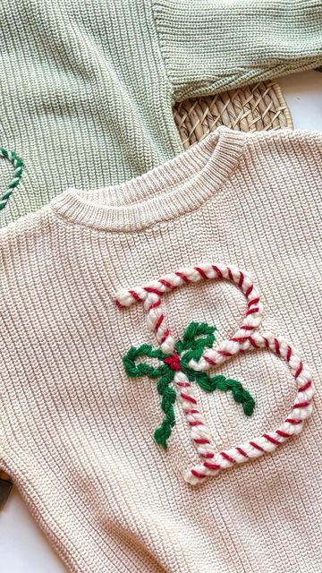 Stitchin With Samantha on Instagram: "DIY Bow Christmas Sweater!👇🎄  The cutest keepsake for the holidays - or matching family outfits for Christmas morning!!🥹  Comment BOW for the link to my YouTube tutorial, my DIY Kit, and all the supplies I used to make this!  Eeeeekk I can’t wait to put Olivia in this for the Christmas season!!🥹❤️  I had the fun idea to do the bow in greenery and I LOVE how it turned out!   #embroidery #handembroidery #christmas #christmascrafts #diyembroidery #embroideredsweater #babysweater #christmasgifts #momlife #momcrafts #handembroideryclothing #handembroideredclothes #handembroidered #diycrafts #holidaycrafts #diy" Bow Sweater Diy, Diy Bow Christmas, Christmas Sweater Embroidery, Ugly Christmas Sweater Outfit, Outfits For Christmas, Diy Christmas Sweater, Christmas Sweater Outfits, Ugly Sweater Diy, Stick And Stitch