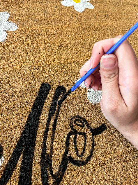 How to Make Your Own Doormat Using Acrylic Paint - Simply Secen Diy Painted Fall Doormat, Diy Personalized Doormat, Diy Christmas Rug Painting, Halloween Doormat Painting Party, How To Paint A Rug Porch, Painting An Outdoor Rug, Sip And Paint Halloween Door Mat, How To Paint A Rug Diy, Fall Crafts Easy Adults