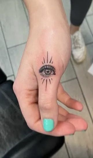 Eye Tattoo On Palm Of Hand, Eye Finger Tattoos For Women, All Seeing Eye Finger Tattoo, Finger Eye Tattoo, Evil Eye Finger Tattoos For Women, Eye Tattoo On Finger, Evil Eye Finger Tattoo, Eye Finger Tattoo, Meaningful Finger Tattoos