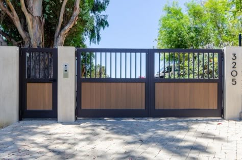 Metal And Wood Driveway Gate, Wood Gates Ideas Driveways, Driveway Gate With Door, Driveway Gates With Pedestrian Gate, Metal Front Gate Entrance Driveway, Ranch Style Gates Driveway Entrance, Modern Privacy Gates Driveway Entrance, Iron And Wood Gate Design, Double Entry Gates