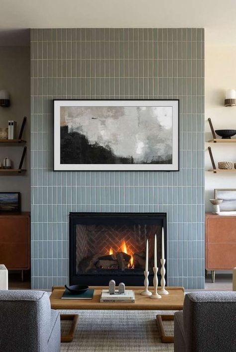 Fireplaces are a dream feature of many homes, but they can have a pretty outdated look. Get inspired by these modern fireplace ideas from interior designers. #fireplace #modernfireplace #cozyspace #interiordesign Fireplace Tile Ideas Modern White, Tall Tiled Fireplace Wall, Tile Fireplace Makeover Modern, Fire Box Fireplace, Stacked Tile Fireplace Surround, Fireplace Mosaic Tile, Fireplace Feature Wall Ideas Modern, Tiled Fireplace Ideas Modern, Wood Panel Over Fireplace