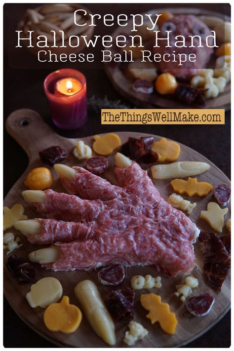 A Halloween-themed cheese platter featuring a spooky Halloween hand made of meat alongside eerie cheese shapes, all beautifully arranged next to a flickering purple candle on a rustic wooden board. Cheese Ball Halloween, Cheese Ball Recipe, Healthy Halloween Snacks, Halloween Snack, Healthy Holiday Recipes, Ideal Protein, Healthy Halloween, Ideal Shape, Party Snack