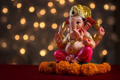 Hindu god ganesha on blured bokhe, ganes... | Premium Photo #Freepik #photo #flower #light #hands #face Pillayarpatti Vinayagar Hd Wallpaper, Ganpati Photo Hd, Om Gam Ganapataye Namaha, Diwali Light, Small Wedding Decor, Batman Joker Wallpaper, Joker Wallpaper, Ganesh Ji Images, Ganpati Bappa Wallpapers