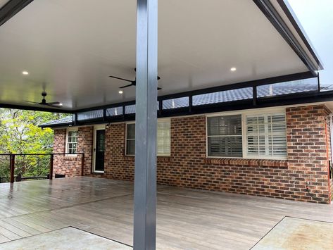 Looking cool 😎 With the holiday season coming up, this Flyover Outback® Cooldek Patio with Composite Decking is great for keeping guests protected from the sun. Stratco Authorised Outback® Dealer Narellan Home Improvement Centre have installed this lovely patio with integrated lighting and ceiling fans. The flyover design with riser brackets increases height while bringing some natural light in. Get a free quote 👉 bit.ly/stratco-quote #stratco #howto #stratcooutback #outbackpatio Raked Ceiling Outdoor Area, Alfresco Roof Extension, Flyover Patio Roofs, Patio Roof Risers, Alfresco Skylight, Stratco Patio Flat Roof, Fire Area, Backyard Pavilion, Back Deck