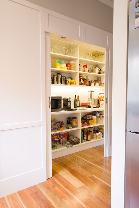 Walk in pantry. Contemporary kitchen. Sliding doors. www.thekitchendesigncentre.com.au Walk In Pantry Sliding Door, Sliding Doors Kitchen Cabinets, Sliding Doors Pantry, Semi Walk In Pantry, Walk In Pantry No Door, Hidden Pantry Storage, Pantry With Sliding Doors, Walk In Pantry Dimensions, Narrow Walk In Pantry