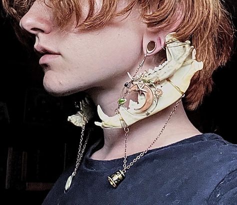 These double gauge hangers/earrings are made from naturally sourced jawbones collected by the maker. They also feature two distinct pendants that display angelic and astrological themes to create a very whimsical, elegant piece with a dark undertone. They are recommended to be worn with silicone ring gauges to create a more comfortable experience but can be worn with metal, or bare ears. They are designed for gauged ears and create a weight for the stretched lobe, but could potentially be worn w Character Design Jewelry, Cool Ear Rings, Non Piercing Earrings, Unique Accessories Fashion, Gauged Ears With Piercings, Warlock Jewelry, Jaw Jewelry, Double Pierced Ears, Earrings Reference