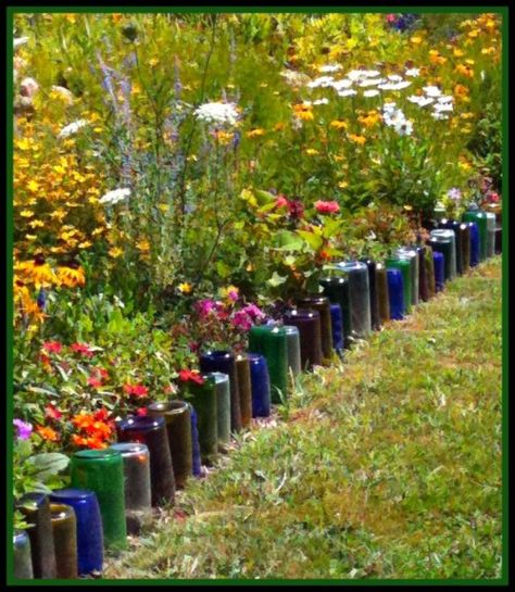 Use glass bottles to edge your garden path. Wine Bottle Garden, Recycled Garden, Edging Ideas, Bottle Garden, Landscape Edging, Lawn Edging, Diy Outdoor Decor, Wildflower Garden, Garden Edging